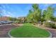 Serene green space with walking path, mature trees, and landscaping enhances the property's curb appeal at 5855 Valley Dr # 1070, North Las Vegas, NV 89031