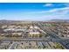 Wide aerial shot of neighborhood showing proximity to shopping centers and city at 6432 Linden St, North Las Vegas, NV 89086