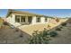 Backyard featuring low-maintenance desert landscaping, patio, and privacy fence at 6432 Linden St, North Las Vegas, NV 89086