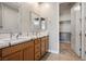 Bathroom featuring double sinks and a spacious walk-in closet at 6432 Linden St, North Las Vegas, NV 89086