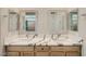 A stylish bathroom features double sinks and granite countertops at 6432 Linden St, North Las Vegas, NV 89086