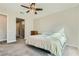 A spacious bedroom features a ceiling fan and neutral carpeting at 6432 Linden St, North Las Vegas, NV 89086