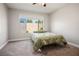 Cozy bedroom featuring a comfy bed, carpet, and a large window with views to the outside at 6432 Linden St, North Las Vegas, NV 89086