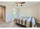 A clean bedroom with en-suite bathroom and neutral walls at 6432 Linden St, North Las Vegas, NV 89086