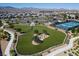 Aerial view of community dog park and tennis courts with mountains in background at 6432 Linden St, North Las Vegas, NV 89086