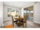 Dining area with wood flooring and a sliding glass door to the patio at 6432 Linden St, North Las Vegas, NV 89086