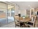 Dining area with a sliding glass door to the patio at 6432 Linden St, North Las Vegas, NV 89086