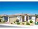 Charming single-story home with a well-manicured front yard and a two-car garage at 6432 Linden St, North Las Vegas, NV 89086