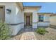 Inviting front entrance with a decorative stone pathway and neutral-toned exterior at 6432 Linden St, North Las Vegas, NV 89086