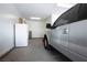 Spacious two-car garage with a refrigerator and a truck parked inside at 6432 Linden St, North Las Vegas, NV 89086