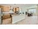 Contemporary kitchen featuring stainless steel appliances, granite countertops, and natural wood cabinetry at 6432 Linden St, North Las Vegas, NV 89086