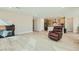 Open-concept living room featuring hardwood floors and a fireplace at 6432 Linden St, North Las Vegas, NV 89086