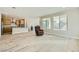 Bright living room connects to a modern kitchen, hardwood floors, and a cozy sitting area at 6432 Linden St, North Las Vegas, NV 89086