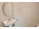A stylish powder room features a pedestal sink and modern fixtures at 6432 Linden St, North Las Vegas, NV 89086