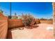 Private backyard with a brick-paved patio area surrounded by a block wall and lush oleander bush at 6747 Gold Yarrow St, Las Vegas, NV 89148