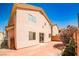 A well kept backyard with a cozy brick patio and privacy provided by mature landscaping at 6747 Gold Yarrow St, Las Vegas, NV 89148