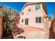 Charming backyard showcasing a brick patio with mature landscaping at 6747 Gold Yarrow St, Las Vegas, NV 89148