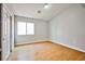 Bright bedroom with light wood floors, a closet and a window at 6747 Gold Yarrow St, Las Vegas, NV 89148