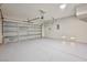 Clean and spacious garage featuring a rolling garage door and epoxy flooring at 6747 Gold Yarrow St, Las Vegas, NV 89148