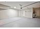 Spacious garage with epoxy flooring, ample storage, and utility connections at 6747 Gold Yarrow St, Las Vegas, NV 89148