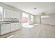 Bright kitchen flowing to the open living room and sliding door to the backyard at 6747 Gold Yarrow St, Las Vegas, NV 89148