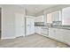 Renovated kitchen with white cabinets, modern appliances, and granite countertops at 6747 Gold Yarrow St, Las Vegas, NV 89148