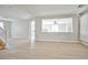 Open-concept living room with hardwood floors and neutral paint throughout at 6747 Gold Yarrow St, Las Vegas, NV 89148