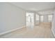 Open living room with wood-look floors leading into other rooms at 6747 Gold Yarrow St, Las Vegas, NV 89148