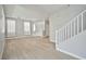 Open living room with wood-look floors and white trim and walls at 6747 Gold Yarrow St, Las Vegas, NV 89148