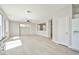 Living room with modern fixtures and hardwood floors leading to the kitchen at 6747 Gold Yarrow St, Las Vegas, NV 89148