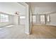 Bright, open living room featuring light-tone floors, fresh paint, and abundant natural light, creating an inviting space at 6747 Gold Yarrow St, Las Vegas, NV 89148