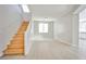 Open living room with wood-look floors and staircase to upper level at 6747 Gold Yarrow St, Las Vegas, NV 89148