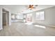 Bright living room with hardwood floors leading into the kitchen and outdoor patio at 6747 Gold Yarrow St, Las Vegas, NV 89148
