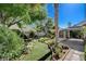 Serene backyard offers a peaceful escape with its well-maintained lawn and covered patio at 7109 Deepriver Cir, Las Vegas, NV 89129