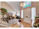 Welcoming foyer with hardwood floors, a high ceiling, and a glimpse into the adjacent living areas at 7109 Deepriver Cir, Las Vegas, NV 89129
