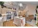 Open kitchen with stainless appliances, tile countertops, a center island, and access to the living area at 7109 Deepriver Cir, Las Vegas, NV 89129