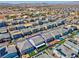 Aerial view of a suburban home with a well-manicured lawn, covered patio, and beautiful landscaping in a Gathering-friendly neighborhood at 7260 Grace Estate Ave, Las Vegas, NV 89113