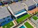Back aerial view shows a lawn, covered patio, and adjacent pool and patio combination enhances the outdoor living space at 7260 Grace Estate Ave, Las Vegas, NV 89113