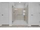This bathroom showcases a glass shower stall with a sleek grab bar and fixtures at 7260 Grace Estate Ave, Las Vegas, NV 89113