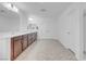 A spacious bathroom with double sinks, plenty of storage, and herringbone flooring at 7260 Grace Estate Ave, Las Vegas, NV 89113