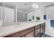 This bathroom features a double sink vanity with modern cabinets and fixtures at 7260 Grace Estate Ave, Las Vegas, NV 89113