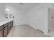 A spacious bathroom with double sinks, a shower, and herringbone flooring at 7260 Grace Estate Ave, Las Vegas, NV 89113