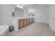 Bright bathroom featuring double sinks, herringbone floors and modern lighting at 7260 Grace Estate Ave, Las Vegas, NV 89113