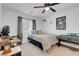 This bedroom features a bed, and desk with lots of bright light at 7260 Grace Estate Ave, Las Vegas, NV 89113