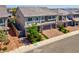 Charming two-story home features a brick driveway, well-manicured lawn, and tasteful landscaping, boosting curb appeal at 7260 Grace Estate Ave, Las Vegas, NV 89113