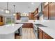 Bright kitchen features a large island, modern appliances, hardwood floors, and backyard access at 7260 Grace Estate Ave, Las Vegas, NV 89113