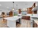 Bright kitchen features a large island, modern appliances, hardwood floors, and backyard access at 7260 Grace Estate Ave, Las Vegas, NV 89113