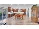 Spacious kitchen features modern appliances, wooden cabinetry, and dining area at 7260 Grace Estate Ave, Las Vegas, NV 89113
