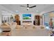 Bright, spacious living room with neutral tones and contemporary fireplace at 7260 Grace Estate Ave, Las Vegas, NV 89113
