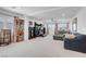 Spacious living room with large windows, neutral carpet and recessed lighting at 7260 Grace Estate Ave, Las Vegas, NV 89113